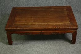 An early 20th century Chinese elm and hardwood coffee table. H.29 W.92 D.61cm.