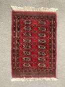 A 20th century Turkoman Tekke rug. L.97 W.64cm.