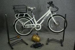 A Pedego City Commuter ladies electric bike with various accessories.