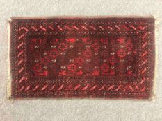 An Esari style rug. L.90 W.52cm.