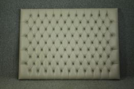 A large double size headboard in deep buttoned faux leather. H.122 W.166cm.