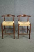 A pair of contemporary vintage Danish style hardwood counter stools. H.81cm. (each).
