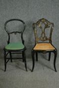 Two Victorian japanned side chairs, one with an ornate splat back and caned seat. H.84cm. (largest).