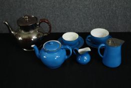 A vintage blue glazed porcelain part tea set and a silver glazed teapot. H.14cm. (largest).