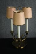 A three branch brass lamp. H.51cm.