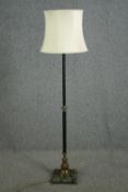 An early 20th century black lacquered and gilt brass standard lamp with a verde antico marble