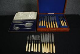 Two sets of silver plated cutlery with simulated horn handles, including a cased fish knife and fork