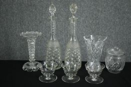 A group of cut glass, including a pair of genie decanters and other items. H.41cm. (largest).