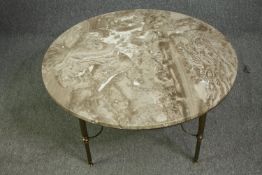 An early 20th century French marble and brass coffee table. H.40 Dia.91cm.