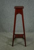 An Edwardian walnut jardiniere stand. H.100cm.