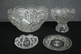 A group of cut glass wares, including a fruit bowl, a comport, and two dishes. H.18 Dia.33cm.