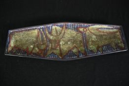 An earthenware dish with stylized bulls, designed by Marianne Starck for Michael Andersen & Son. L.
