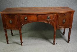 A Regency mahogany bowfront sideboard, circa 1820. H.92 W.183 D.70cm.