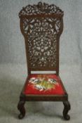 A 19th century Anglo-Indian carved pierced hardwood side chair. H.112cm.