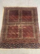 A Hamadan rug with stylised geometric design on a burgundy ground. L.157 W.130cm.