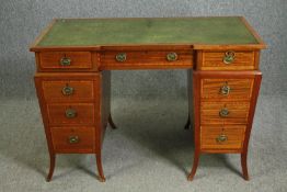 An Edwardian Sheraton revival style satinwood pedestal desk of inverted breakfront form. H.76 W.