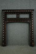 A hardwood and mother of pearl decorated fire surround, possibly Moroccan. H.146 W.130 D.17cm.