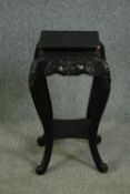 An early 20th century Chinese ebonised hardwood plant stand. H.77cm.