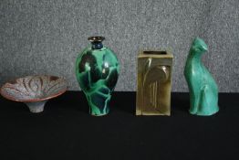 A group of mid 20th century ceramic wares, including a stylized green glazed cat, a flared shape