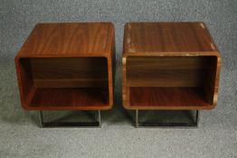 A pair of mid 20th century style teak bedside tables on chrome supports. H.48 W.50 D.50cm. (each).