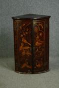 A George II black japanned bowfront hanging corner cabinet with Chinoiserie decoration. H.93 W.60
