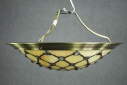 A Tiffany style brass and leaded stained glass ceiling light shade. Dia. 36cm.