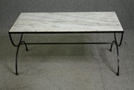 A coffee table with a white carrara mable top on iron x-frame supports. H.54 W.116 D.54cm.