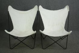 A pair of metal framed and canvas butterfly style reclining chairs. H.90cm. (each).