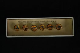 A boxed set of vintage Guinness buttons. L.16 W4.5cm. (box).