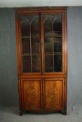 A Regency mahogany bookcase, circa 1820, with gothic arched glazed doors. H.243 W.110 D.37cm.