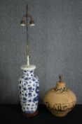 A vintage table lamp base converted from a Chinese blue and white vase along with a baluster form