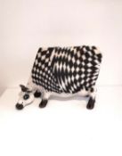 Lawson Rudge, British (1936-), a stylised raku clay glazed sculpture of a cow, chequered black and