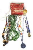A collection of 19th and 20th strings of beads, including two lapis lazuli bead necklaces, a