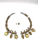 An Etruscan revival roman coin and lion head articulated necklace. (Broken but loose links present.)
