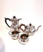 An Art Deco Mappin and Webb three piece silver tea set consisting of teapot, open sugar bowl and