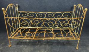 A late 19th century wrought iron French folding bedstead. (Possible use as a garden planter). H.87