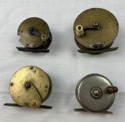 A collection of four vintage centre pin fishing reels. Largest D.8 W.3.5cm