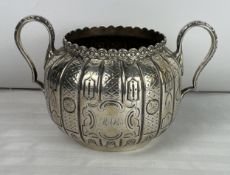 A hallmarked silver twin handled bowl, Sheffield 1859. H.11 W.19cm. 377 grams.
