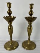 A pair of 19th century brass candlesticks. H.37cm