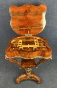 A 19th century Continental flame mahogany work table with fitted interior. H.72 W.55 D.45cm
