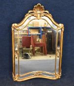 Wall mirror, Rococo style in a gilt frame. H.94 W.60cm.