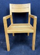 A contemporary oak garden armchair.