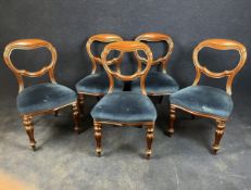 A set of five Victorian mahogany balloon back dining chairs.