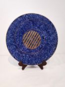 Peter Ting - a Tingware ceramic circular decorative plate with blue dappled ground and gold