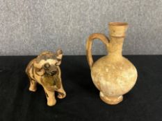 A terracotta glazed central American bull figure along with an antiquity style jug. H.16cm x Dia.