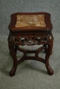 A 20th century Chinese carved Huanghuali or rosewood jardiniere stand with a marble top. H.52 W.40