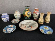 A miscellaneous collection of early 20th century Oriental porcelain to include jars, vases and