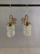 A pair of vintage gilt metal wall lights with crystal drops. H.25cm x W.11cm x D.17cm