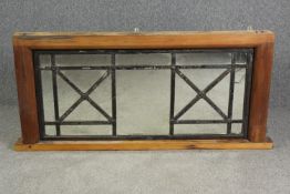 A large wall mirror, leaded glass panels, adapted from a window frame. H.79 W.162 D.11cm.