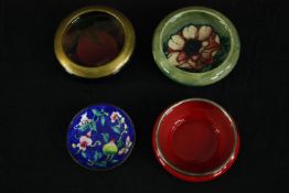 Two Moorcroft bowls, one with Anemone pattern, the other with gilt rim, together with a Royal